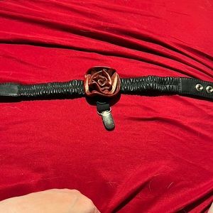 Wild card leather garter with red rosette